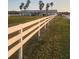 White farm house with palm trees and white fence at 15625 State Road 62 St, Parrish, FL 34219