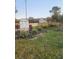 View of the property from the stable, showcasing the main house at 15625 State Road 62 St, Parrish, FL 34219