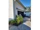Detached garage with an open garage door at 15625 State Road 62 St, Parrish, FL 34219