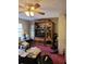 Living Room with wooden entertainment center and red carpet at 15625 State Road 62 St, Parrish, FL 34219