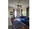 Living room with blue sofa and geometric patterned rug at 15625 State Road 62 St, Parrish, FL 34219