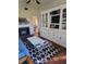 Living room featuring a fireplace and built-in shelving at 15625 State Road 62 St, Parrish, FL 34219