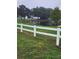 Serene pond with white fence in the foreground at 15625 State Road 62 St, Parrish, FL 34219