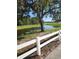 Picturesque pond with two swans and lush green surroundings at 15625 State Road 62 St, Parrish, FL 34219