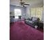 Cozy sitting room with grey sofa and pink carpet at 15625 State Road 62 St, Parrish, FL 34219