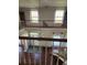 Two-story foyer with hardwood floors and elegant chandelier at 15625 State Road 62 St, Parrish, FL 34219