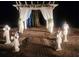 Decorated wedding arch with pathway and flower pillars at 15625 State Road 62 St, Parrish, FL 34219