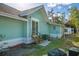 Back exterior of house with patio and small yard at 708 22Nd W St, Bradenton, FL 34205