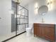 Updated bathroom with a walk-in shower and modern vanity at 708 22Nd W St, Bradenton, FL 34205