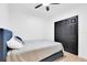 Bright bedroom with a double bed and built-in closet at 708 22Nd W St, Bradenton, FL 34205