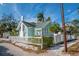 Light green house with white picket fence, curb appeal at 708 22Nd W St, Bradenton, FL 34205