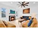Bright living room with fireplace and comfy seating at 708 22Nd W St, Bradenton, FL 34205