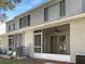 Screened patio and AC unit in the backyard at 2346 Lake Woodberry Cir, Brandon, FL 33510