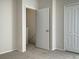 Bedroom with door to the upstairs hallway, and a view of the staircase at 2346 Lake Woodberry Cir, Brandon, FL 33510