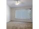Bright bedroom with large window and ceiling fan at 2346 Lake Woodberry Cir, Brandon, FL 33510