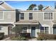 Two-story townhome with gray siding, landscaping, and a walkway at 2346 Lake Woodberry Cir, Brandon, FL 33510