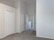 Upstairs hallway with doors to bedrooms and a view of the upper landing at 2346 Lake Woodberry Cir, Brandon, FL 33510