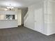 Living room with staircase and neutral color scheme at 2346 Lake Woodberry Cir, Brandon, FL 33510