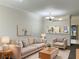 Bright living room features a neutral color palette and comfortable seating at 2346 Lake Woodberry Cir, Brandon, FL 33510
