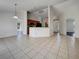 Kitchen with breakfast bar and view into living room at 3766 Johannesberg Rd, North Port, FL 34288