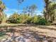 Sunny lot with mature trees and lush landscaping at 3766 Johannesberg Rd, North Port, FL 34288