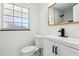 Bathroom with sleek fixtures, a large window, and updated features at 6007 Ambassador Dr, Tampa, FL 33615