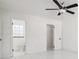 Bright bedroom with tiled floors and ceiling fan and closet at 6007 Ambassador Dr, Tampa, FL 33615