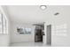 Bright dining area featuring a modern refrigerator, updated tile floors, and plenty of natural light at 6007 Ambassador Dr, Tampa, FL 33615