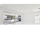 Bright living room with tile floors and sliding glass doors to the outdoors at 6007 Ambassador Dr, Tampa, FL 33615