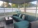Cozy screened-in porch featuring comfortable seating, perfect for enjoying the serene backyard views and outdoor furniture at 6007 Ambassador Dr, Tampa, FL 33615