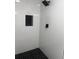 Stylish shower with black and white honeycomb tile flooring at 6007 Ambassador Dr, Tampa, FL 33615