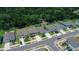 Scenic aerial view showcases neighborhood homes with lush greenery and sunny skies at 7729 Rosewood Garden Loop, Tampa, FL 33637