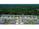 An aerial view highlights a Primary-planned community with picturesque landscaping at 7729 Rosewood Garden Loop, Tampa, FL 33637