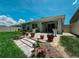 Landscaped backyard patio with pavers and flower pots at 7729 Rosewood Garden Loop, Tampa, FL 33637