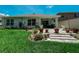 Backyard patio with stone pavers and lush landscaping at 7729 Rosewood Garden Loop, Tampa, FL 33637