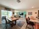 Dining area with view to the living room and the outside porch at 7729 Rosewood Garden Loop, Tampa, FL 33637