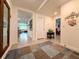 Inviting hallway with tile flooring offering seamless flow to the open-concept living spaces at 7729 Rosewood Garden Loop, Tampa, FL 33637