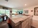 Kitchen island featuring grey granite countertops and stainless steel sink at 7729 Rosewood Garden Loop, Tampa, FL 33637