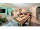 Open-concept living room and kitchen, with modern decor and stainless steel appliances at 7729 Rosewood Garden Loop, Tampa, FL 33637