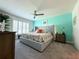 Bright main bedroom with neutral tones, and a ceiling fan at 7729 Rosewood Garden Loop, Tampa, FL 33637