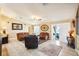 Living room with sliding doors to patio and leather furniture at 13145 Arkendale St, Spring Hill, FL 34609