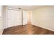 Bedroom with new flooring and double door closet at 5023 Thames Dr, New Port Richey, FL 34652