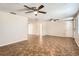 Bright living room featuring tile floors and ceiling fans at 5023 Thames Dr, New Port Richey, FL 34652