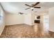 Spacious living room with tile flooring and ceiling fans at 5023 Thames Dr, New Port Richey, FL 34652