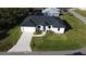 Aerial view of a single-Gathering home with driveway at 10625 Ayear Rd, Port Charlotte, FL 33981