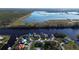 Aerial view showcasing waterfront homes and lush landscape at 10625 Ayear Rd, Port Charlotte, FL 33981