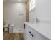 Modern bathroom with walk-in shower, toilet and floating vanity at 10625 Ayear Rd, Port Charlotte, FL 33981