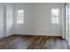Bright bedroom with wood-look tile floors and sliding glass doors at 10625 Ayear Rd, Port Charlotte, FL 33981