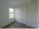 Well-lit bedroom featuring a large closet and a window with nature views at 10625 Ayear Rd, Port Charlotte, FL 33981