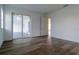 Bright bedroom with wood-look tile floors and sliding glass door to patio at 10625 Ayear Rd, Port Charlotte, FL 33981